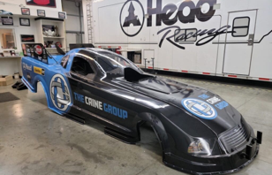 The Caine Group Funny Car in the Head Racing shop
